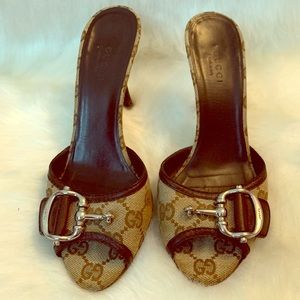 Gucci monogram horsebit slide heel.